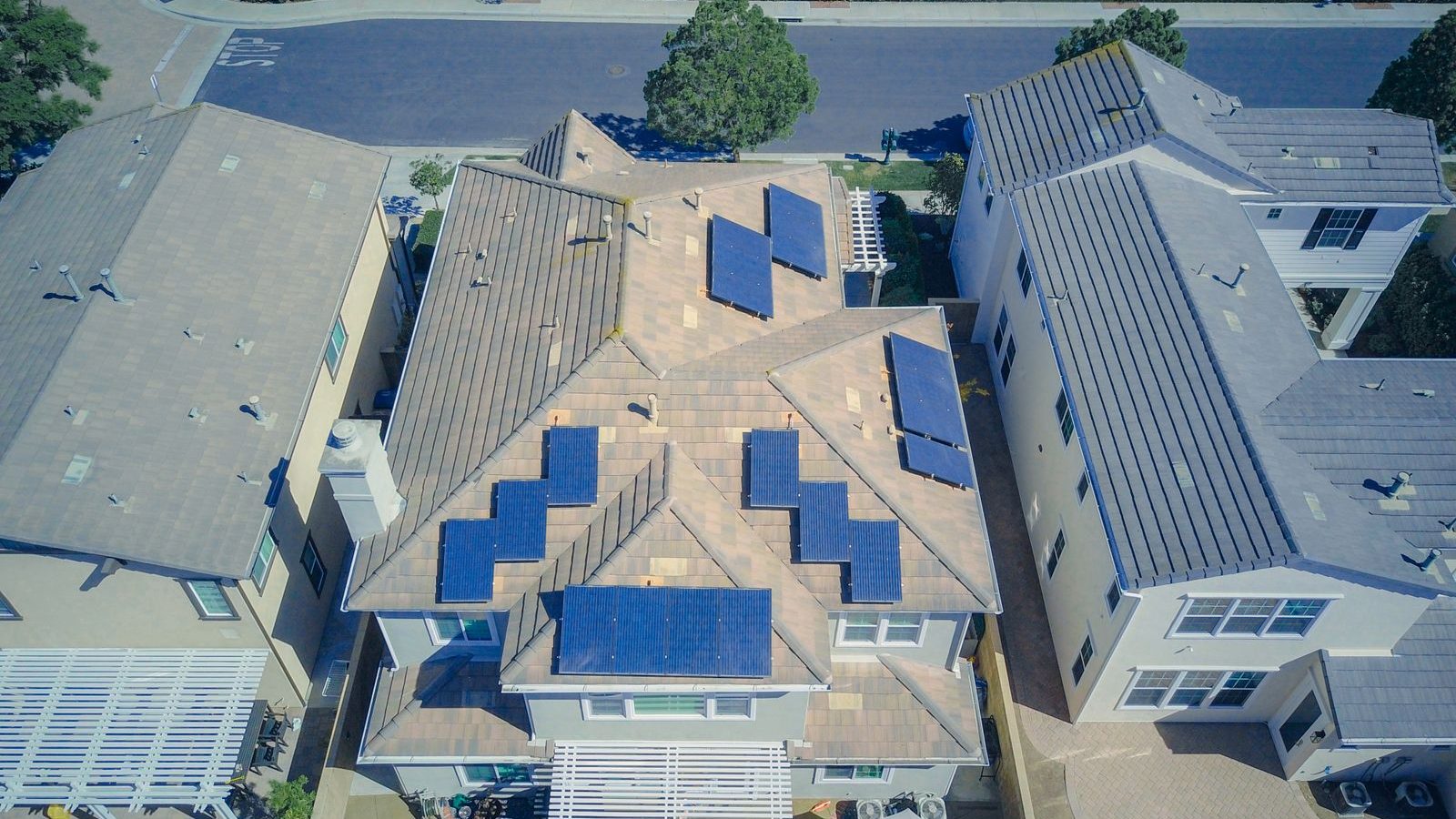 Aerial view of suburban homes with solar panels