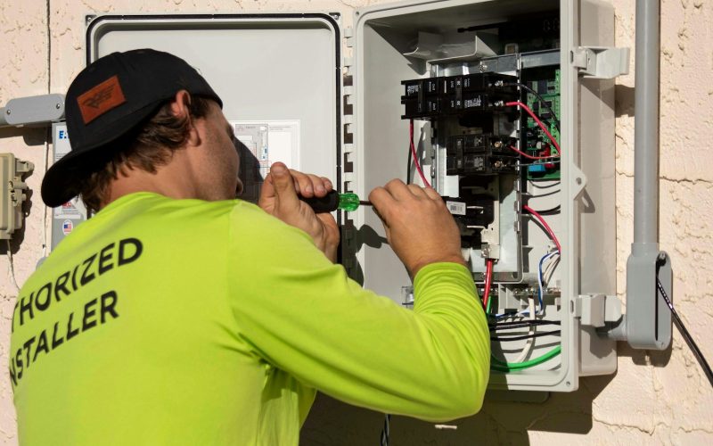 Authorized installer wiring an electrical panel