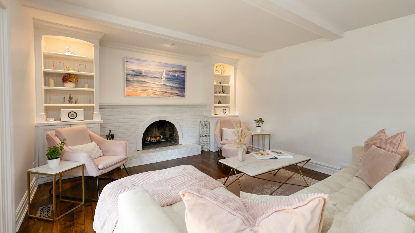 Bright living room with white walls and fireplace
