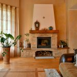 Cozy living room with a stone fireplace and large window