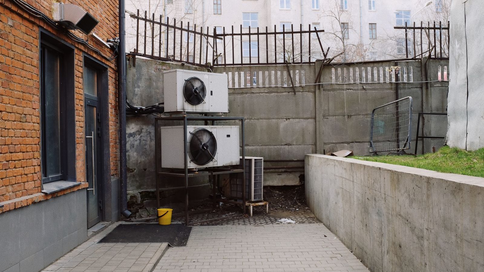 Heat pump outdoor units in a courtyard