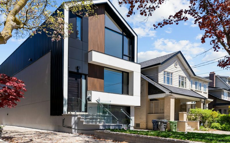 Modern house beside a traditional home