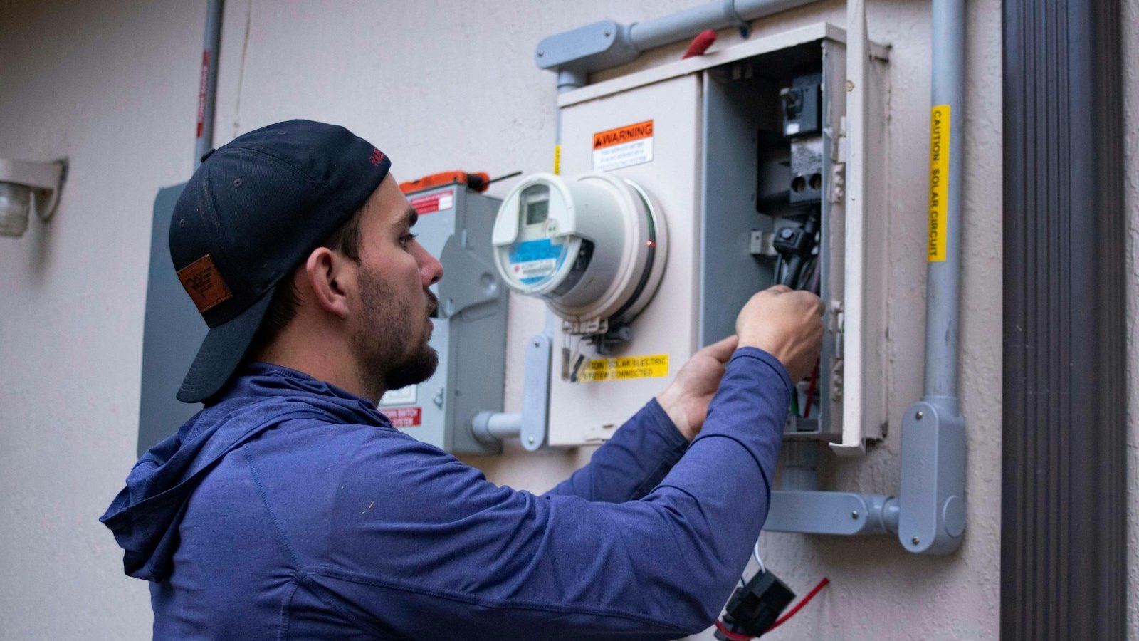 Technician checking an electrical meter
