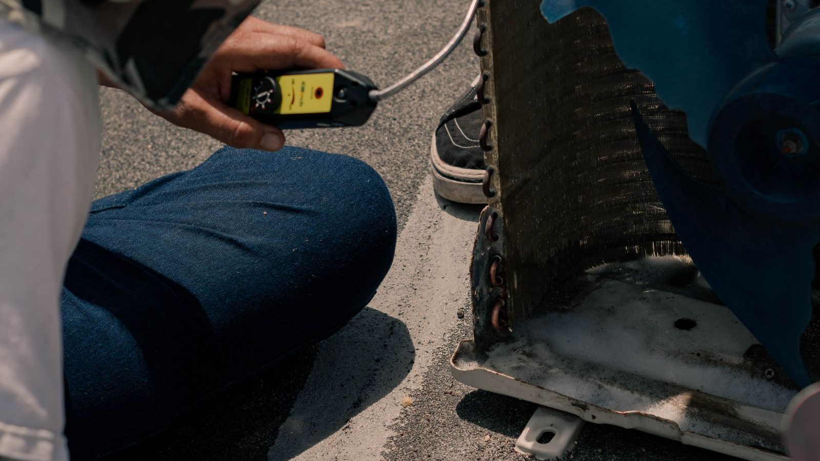 Technician testing a heat pump with a multimeter