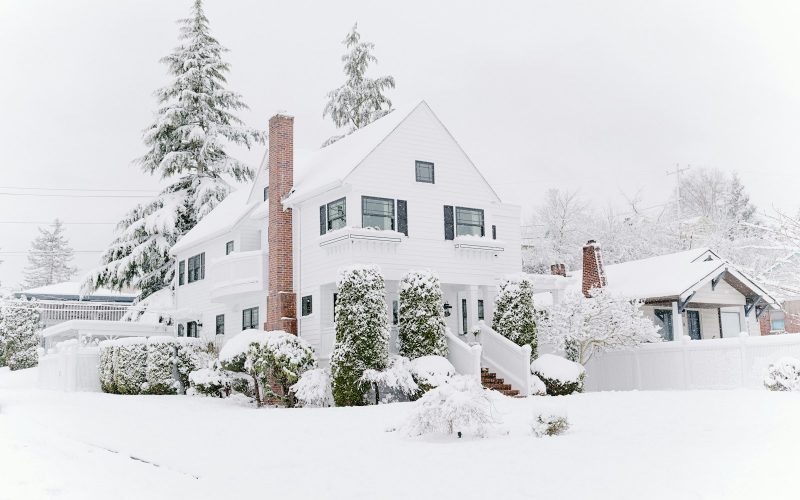 White house covered in snow during winter